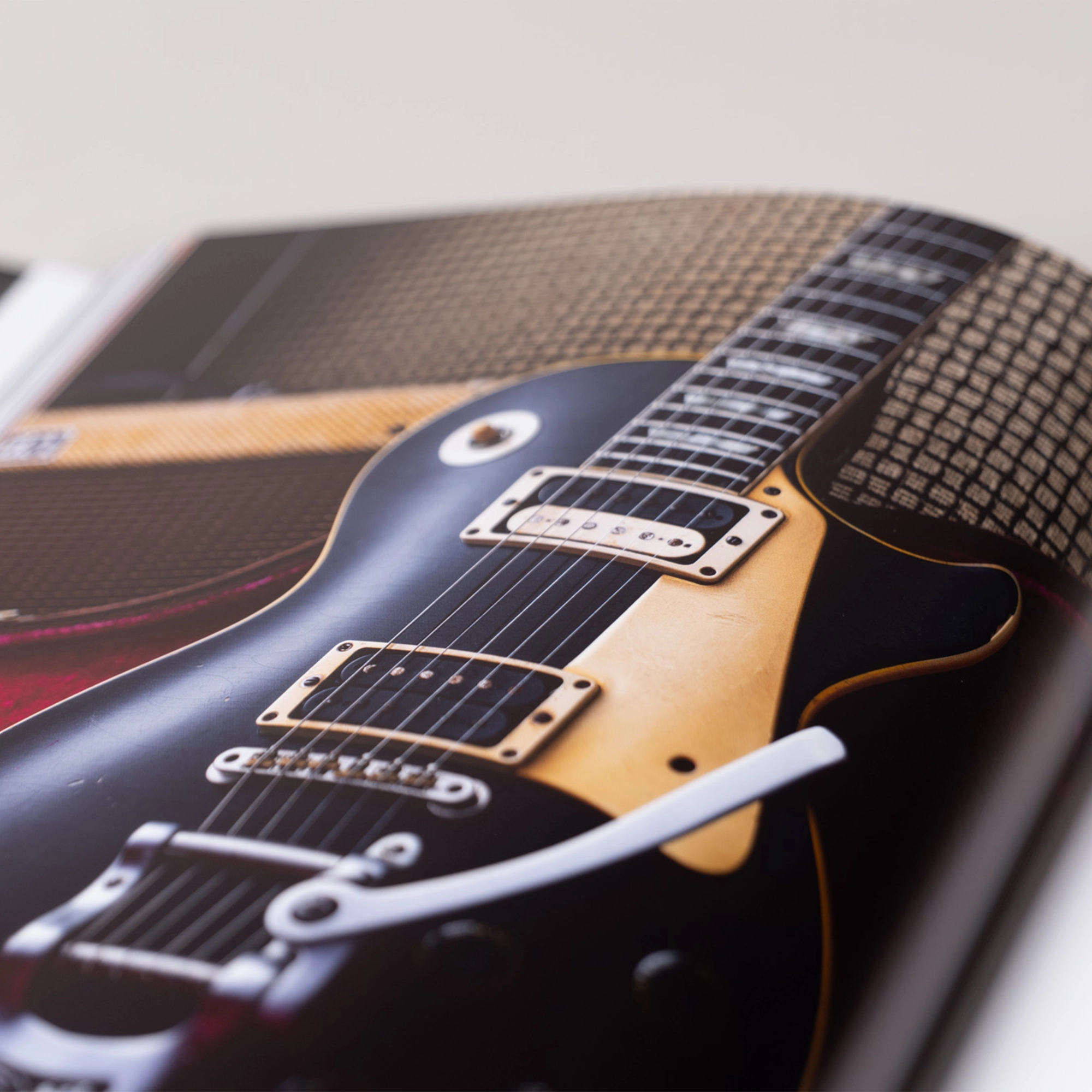 An interior, high-definition photograph of a guitar